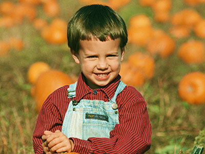 Child in pumpking patch